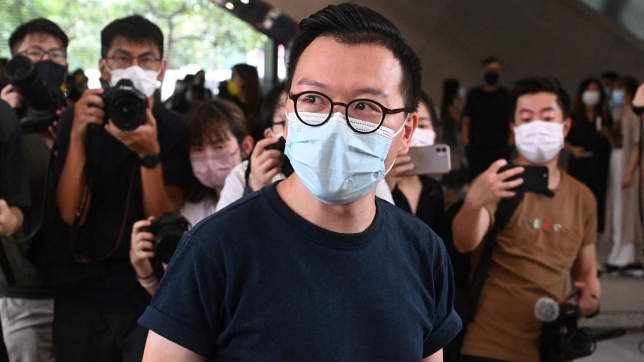 Kalvin Ho, one of the 47 pro-democracy activists charged under the National Security Law for participating in an unofficial primary election last year, arrives for mention at West Kowloon court in Hong Kong. Credit: AFP Photo