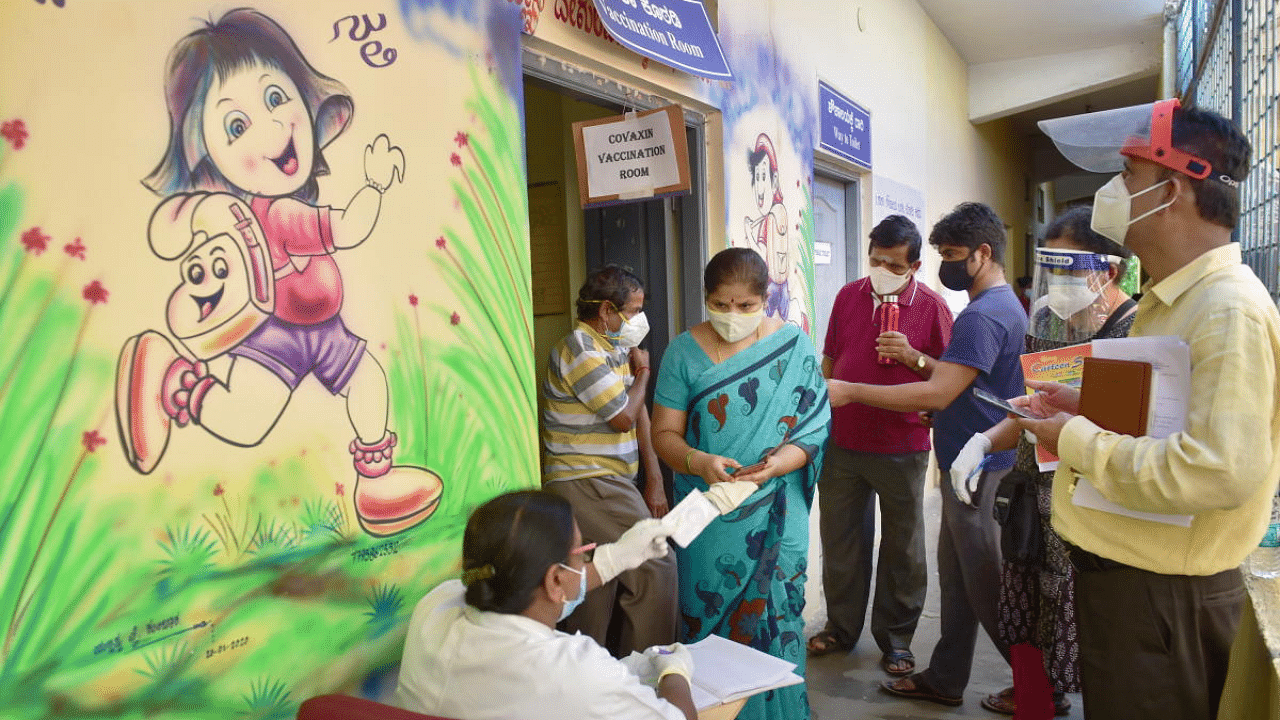 Beneficiaries register for the Covid-19 vaccine dose at a vaccination centre in Bengaluru. Credit: PTI Photo