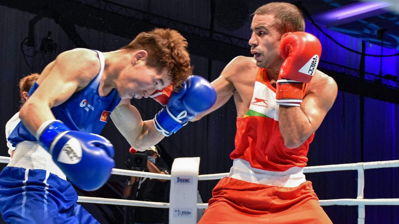 India's Amit Panghal (R) in action against Kharkhuu Enkhmandakh in the 52kg quarter-finals at the ASBC Asian Boxing Championships 2021, in Dubai, Wednesday, May 26, 2021. Credit: PTI Photo