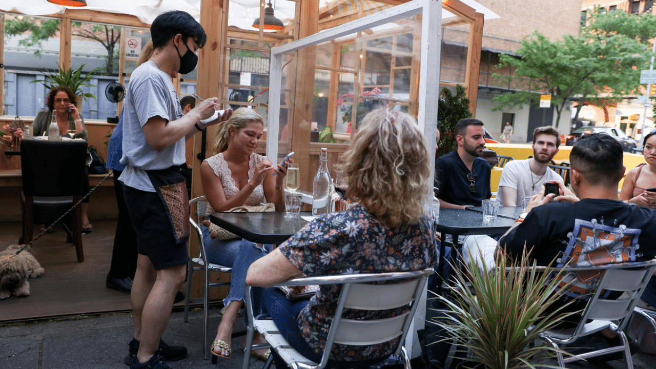 Guests enjoy outdoor dining in the Manhattan borough of New York City. Credit: Reuters Photo