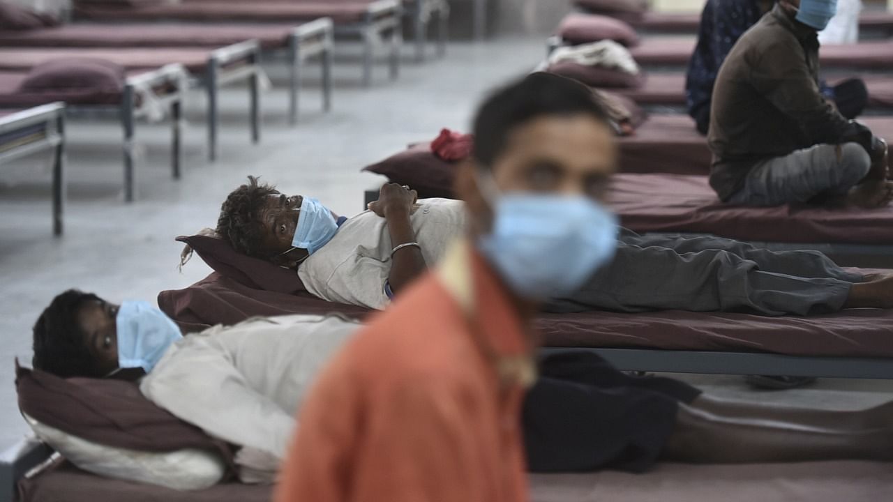 Homeless Covid-19 patients receive treatment at an isolation ward facility of a Covid-19 care centre, in New Delhi. Friday, May 28, 2021. Credit: PTI Photo