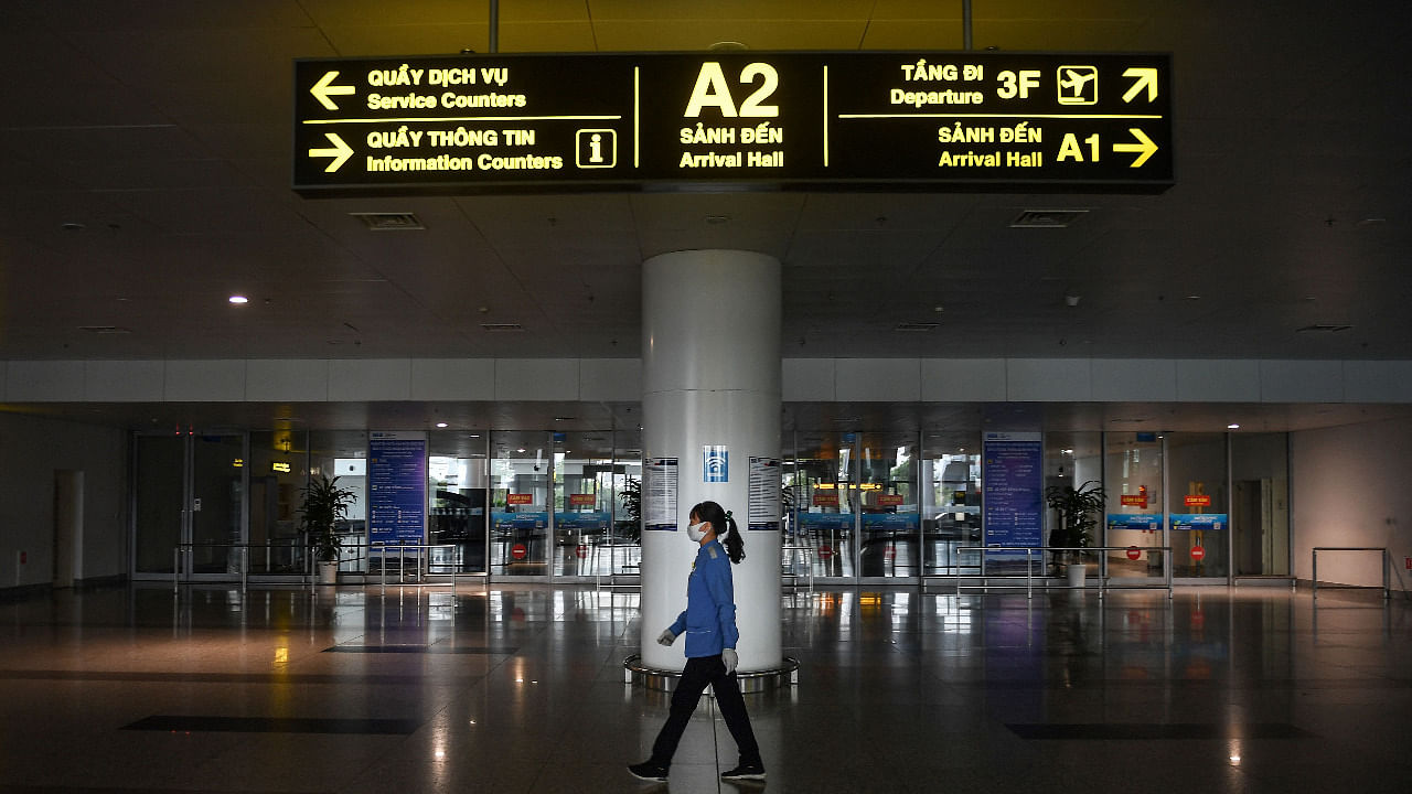 A cleaner walks past the arrival hall of Noi Bai International Airport in Hanoi. Credit: AFP Photo