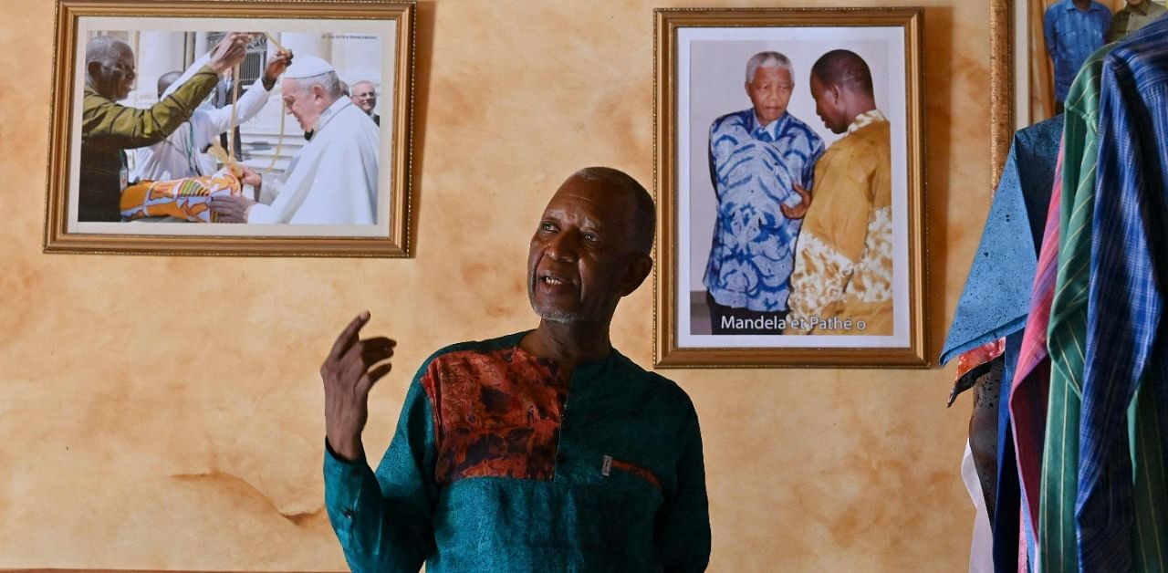 A tall, slender man at 70 with the face of a wise elder, Pathe'O is never seen without one of his own vibrant shirts. Credit: AFP Photo