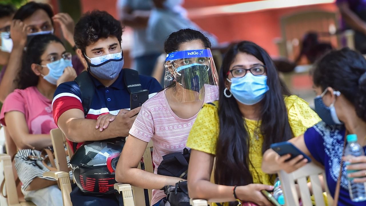 Students wait in a queue to receive Covid-19 vaccine doses during a special vaccination drive for the students, who are going abroad for education and employment, in Bengaluru, Wednesday, June 2, 2021. Credit: PTI Photo