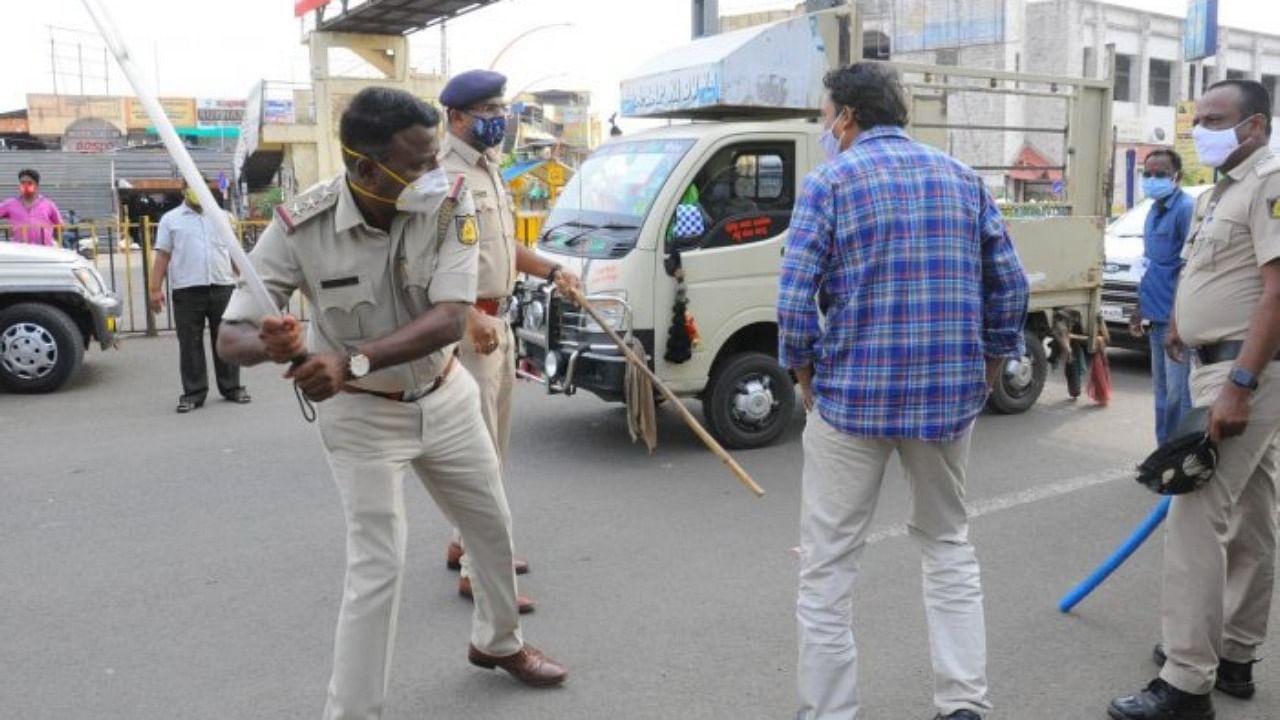 Police thrashed this man in Vijayapura on Monday. Videos of police excesses are pouring in from all parts of Karnataka, and triggering huge public outrage. Credit: DH Photo