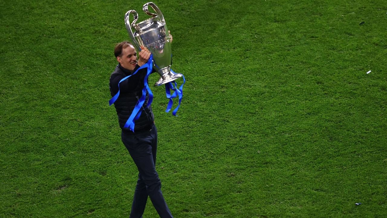 Chelsea manager Thomas Tuchel celebrates with the trophy after winning the Champions League. Credit: Reuters photo