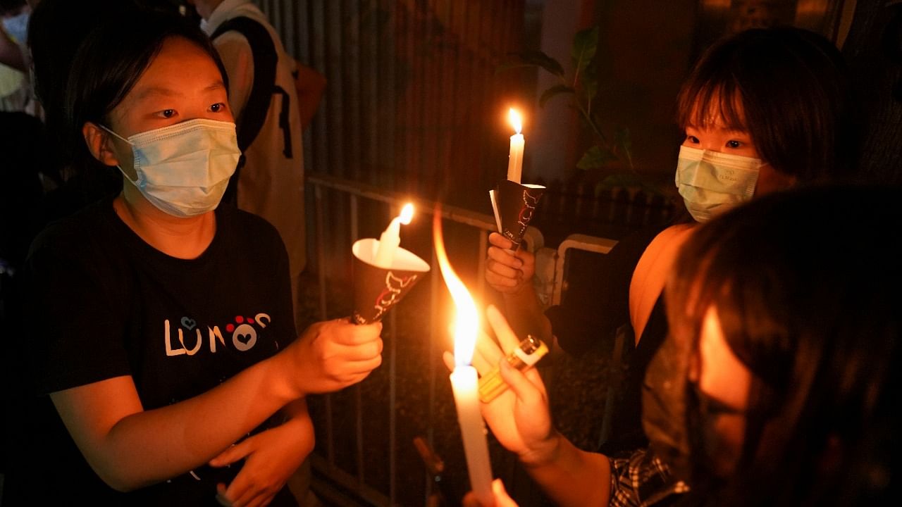 People light candles at Victoria Park on the 32nd anniversary of the crackdown on pro-democracy demonstrators at Beijing's Tiananmen Square in 1989, in Hong Kong. Credit: Reuters Photo