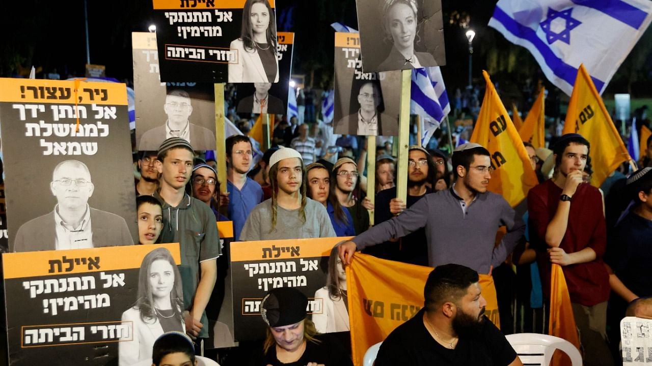 Right-wing Israeli supporters of Prime Minister Benjamin Netanyahu gather during a demonstration against the coalition to form a government. Credit: AFP Photo
