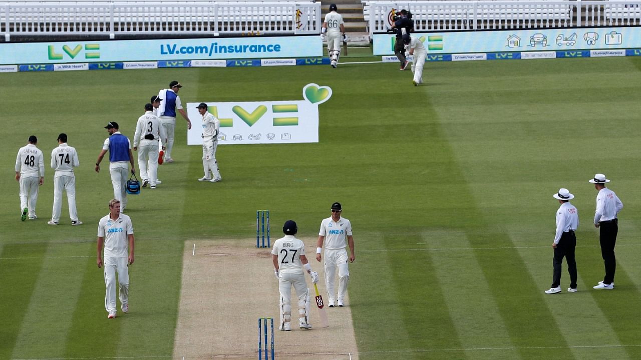England's Joe Root (top-L) walks off for 42 on the fourth day of the first Test cricket match between England and New Zealand. Credit: AFP File Photo