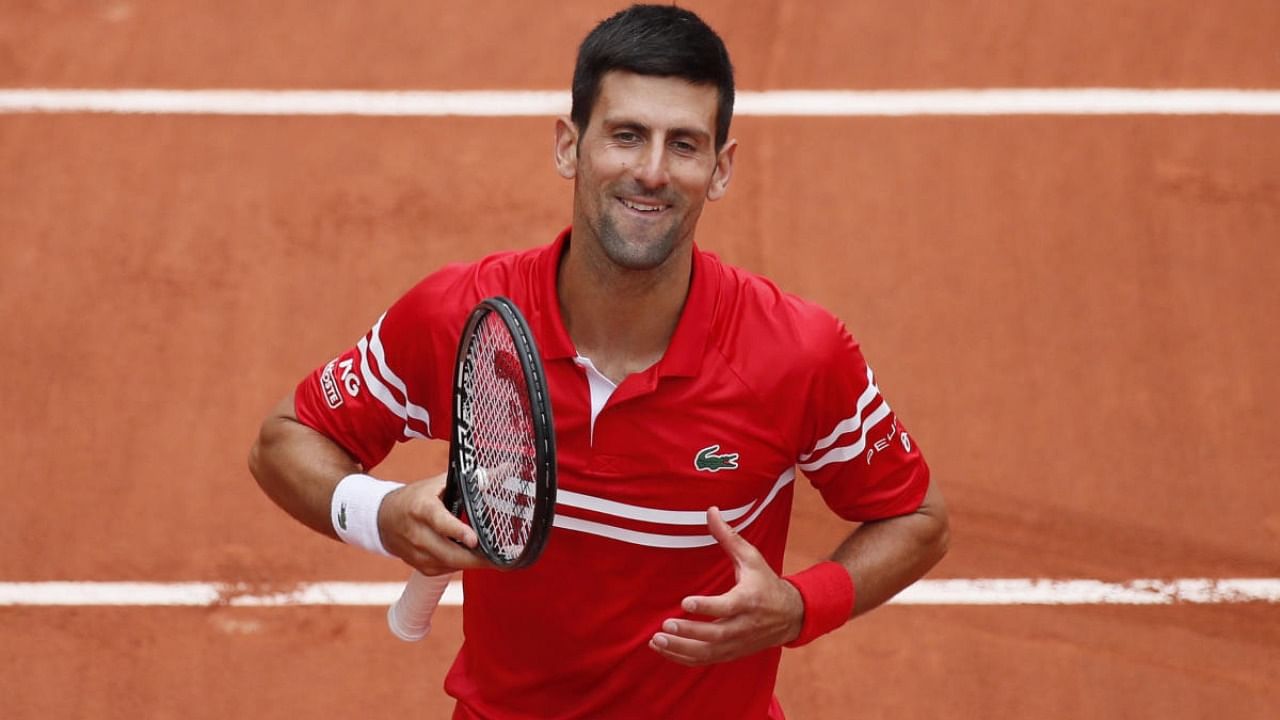  Serbia's Novak Djokovic celebrates after winning her third round match against Lithuania's Ricardas Berankis. Credit: Reuters Photo