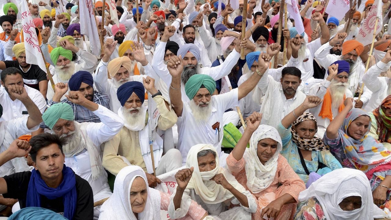 Members of various farmers organizations protest against the Central Government over three farm reform laws, near BJP office in Amritsar. Credit: PTI Photo