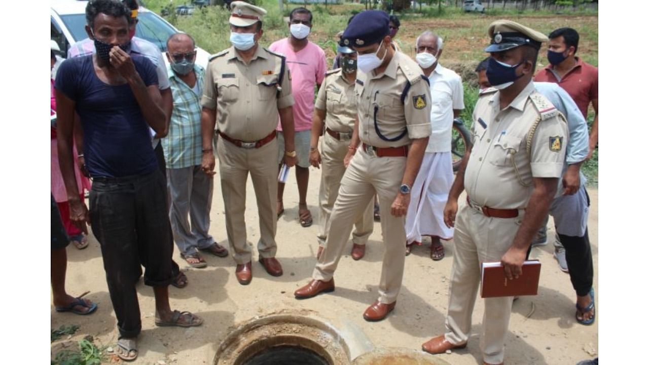 Three workers died after they entered an under-construction manhole at Malleshwara Layout. Credit: DH Photo