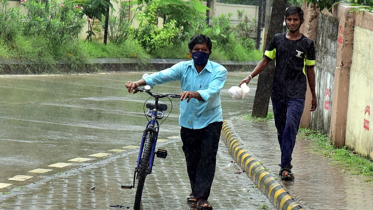 Rain lashed Mangaluru on Saturday morning. Credit: DH Photo/Govindraj Javali