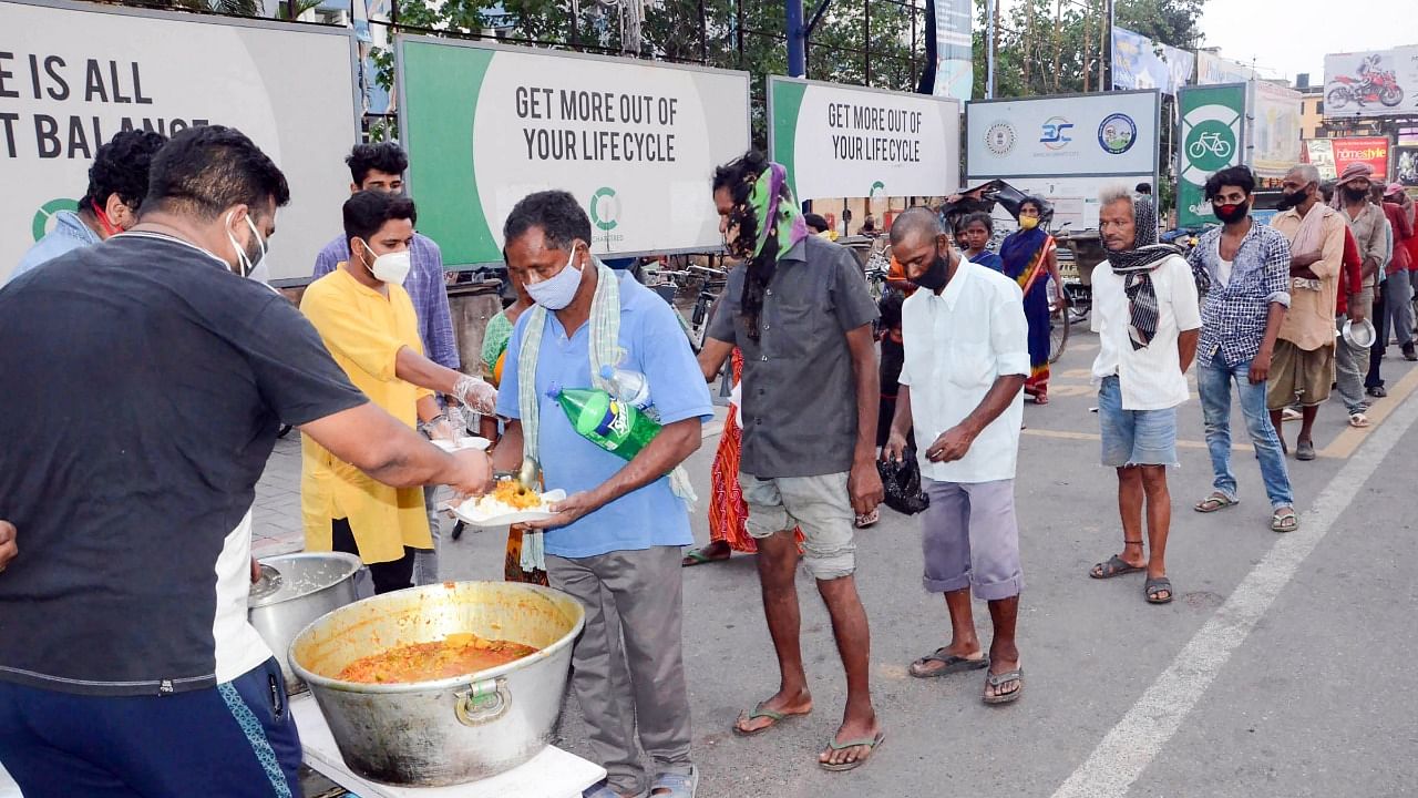 Members of National Students Union of India (NSUI) Jharkhand Wing distribute food among needy during the ongoing coronavirus pandemic, in Ranchi, Friday, June 4, 2021. Credit: PTI Photo