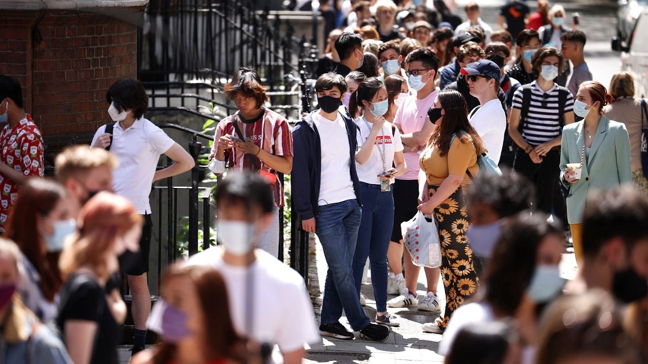 People queue outside a vaccination centre for young people and students in London. Credit: Reuters Photo
