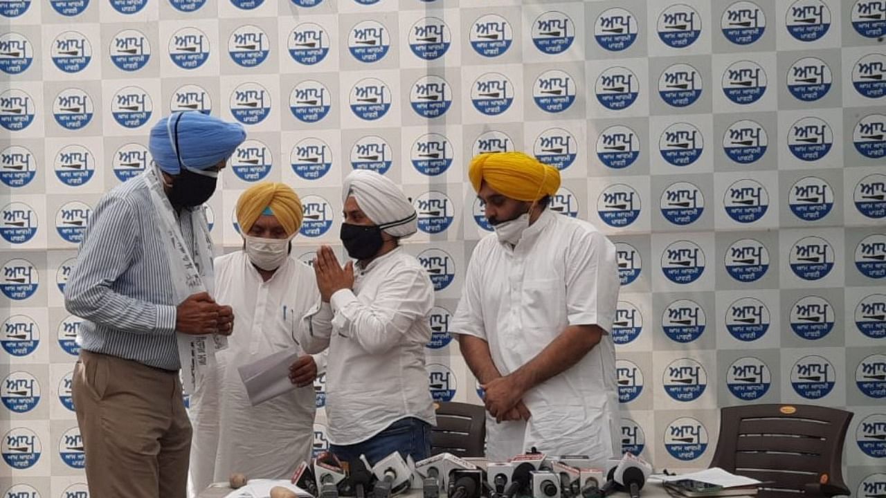 AAP's Punjab unit chief Bhagwant Mann and state affairs in-charge Jarnail Singh welcomed him into the party fold. Credit: Twitter/@AAPPunjab