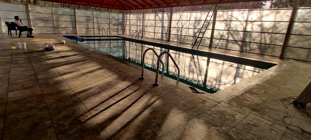 The swimming pool at the official residence of DC in Mysuru. DH PHOTO