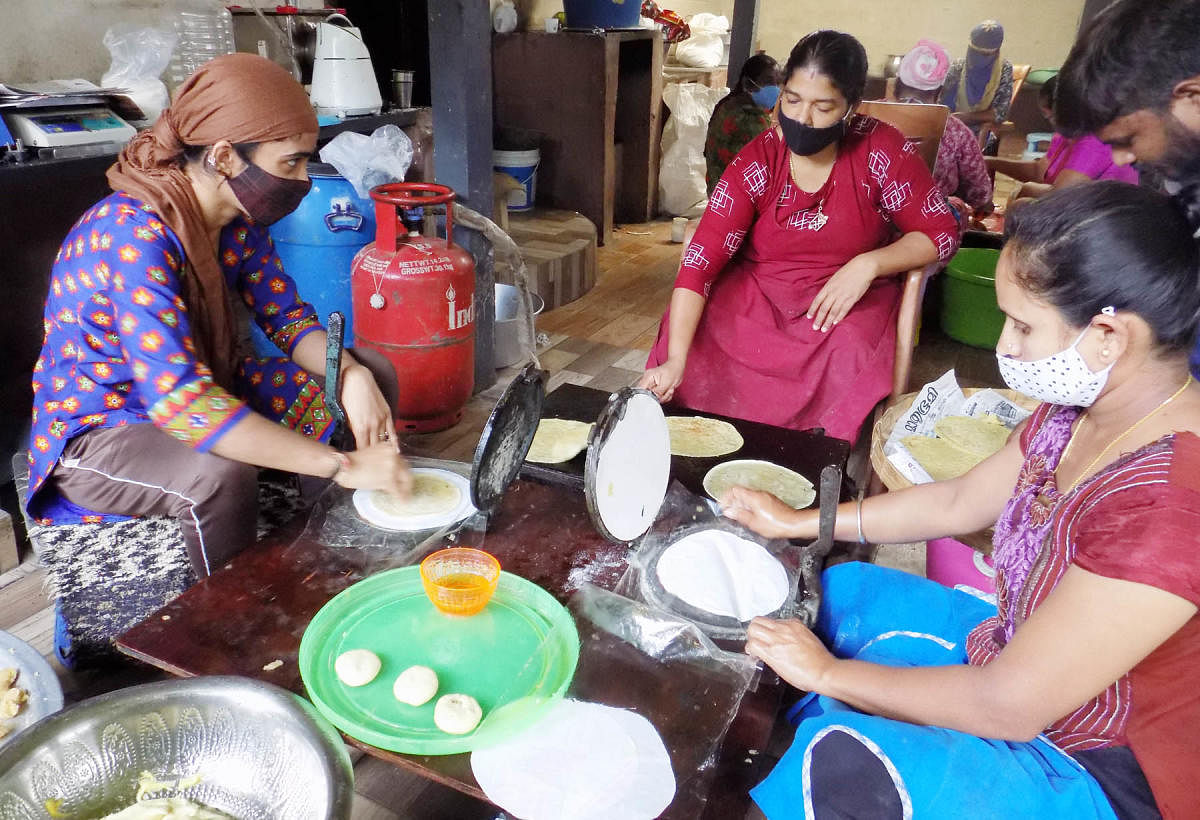 Women prepare condiments at a unit in Aruvathokkalu.