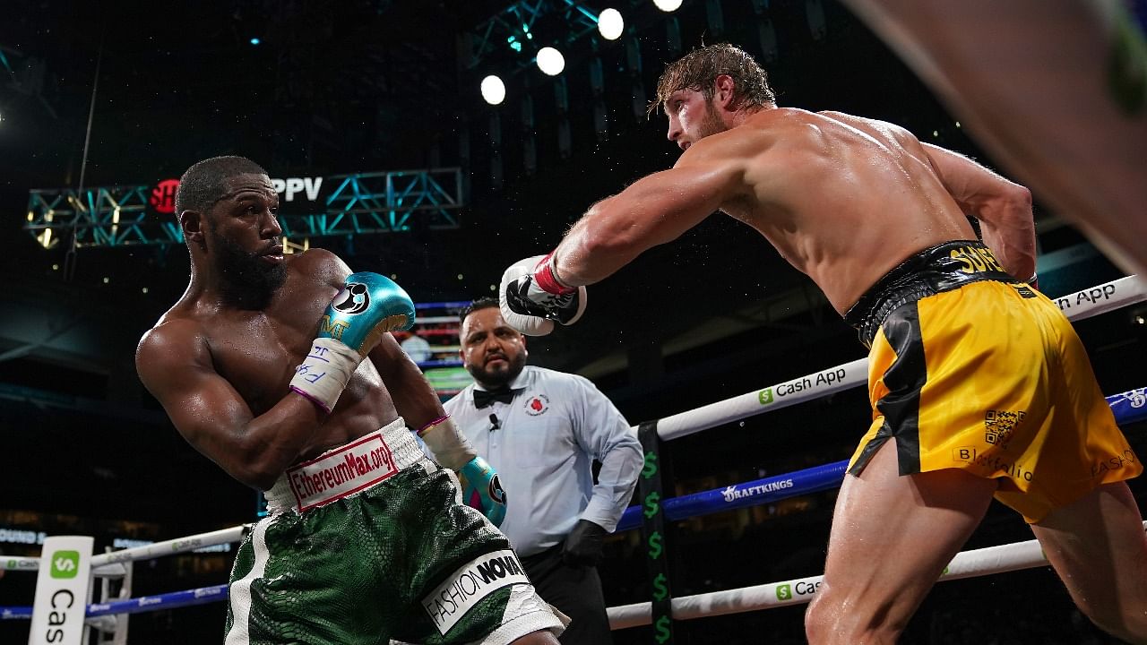 Floyd Mayweather Jr. (Green Trunks) fights Logan Paul (Yellow Trunks) during an exhibition boxing match at Hard Rock Stadium. Credit: Jasen Vinlove-USA TODAY Sports