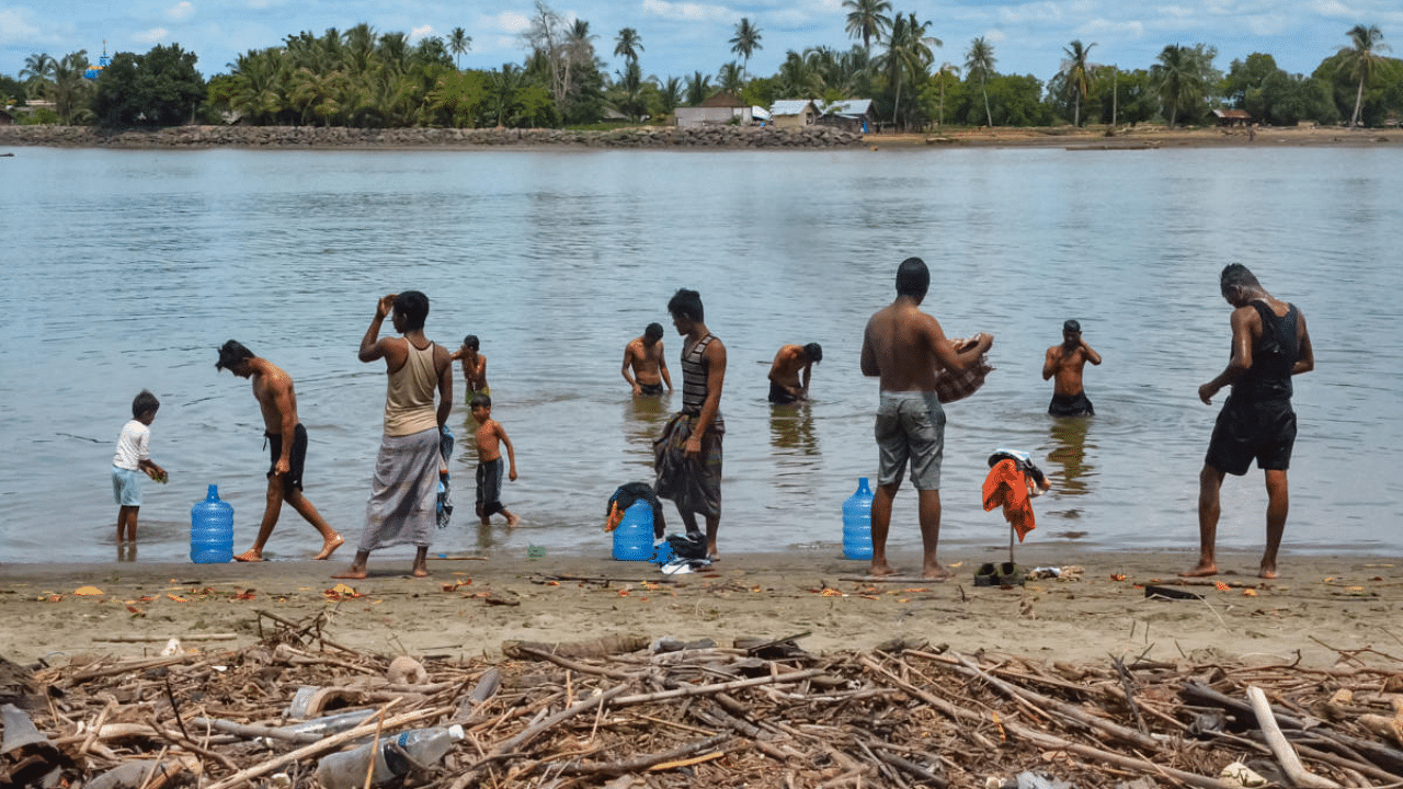 Rohingya refugees bathe at a beach in Pulau Idaman, a small island off the coast of East Aceh in northern Sumatra. Credit: AFP Photo