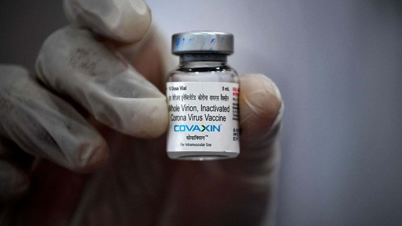 A medical worker displays a vial of the Covaxin vaccine against Covid-19. Credit: AFP File Photo