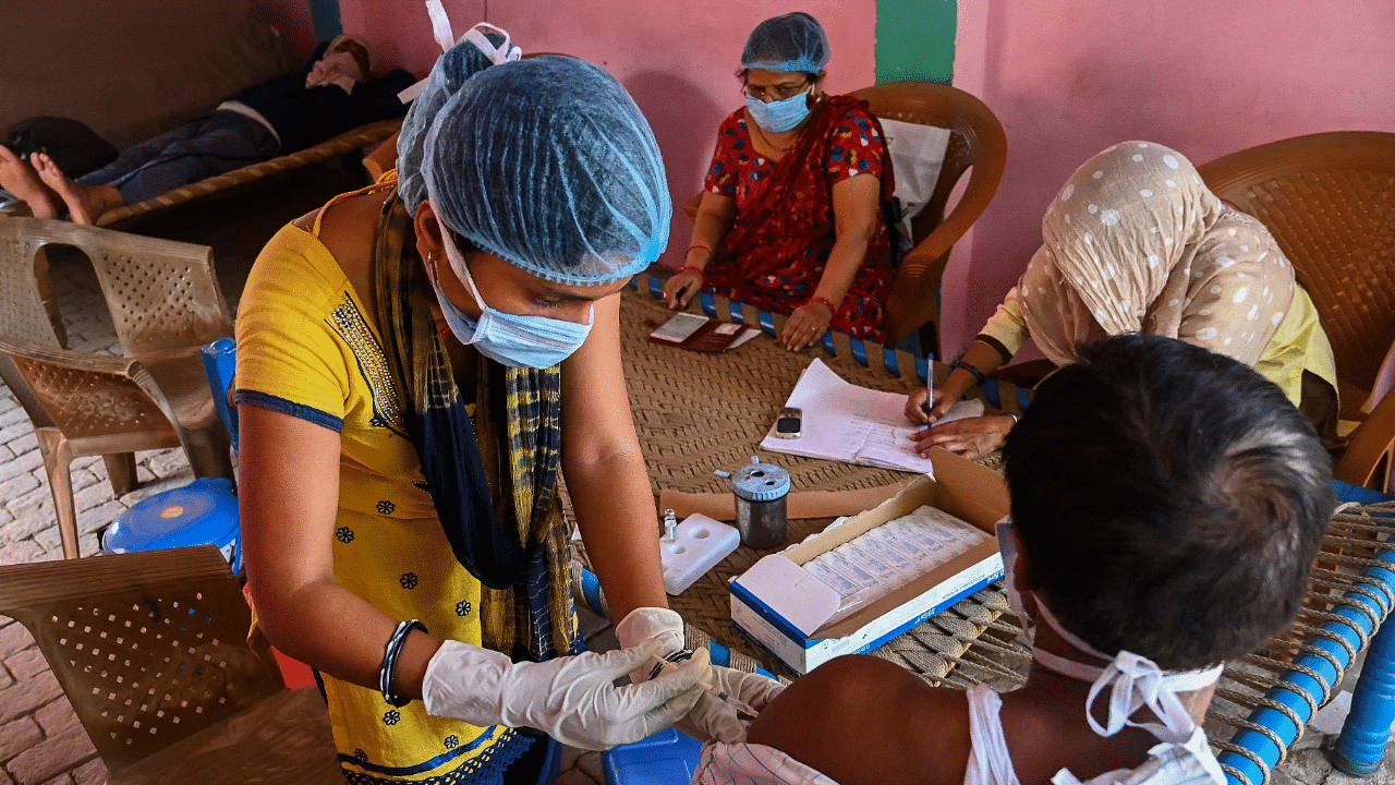 The BBMP is yet to commence vaccination for those above 18 years while it is inoculating people falling under priority groups. Credit: AFP Photo