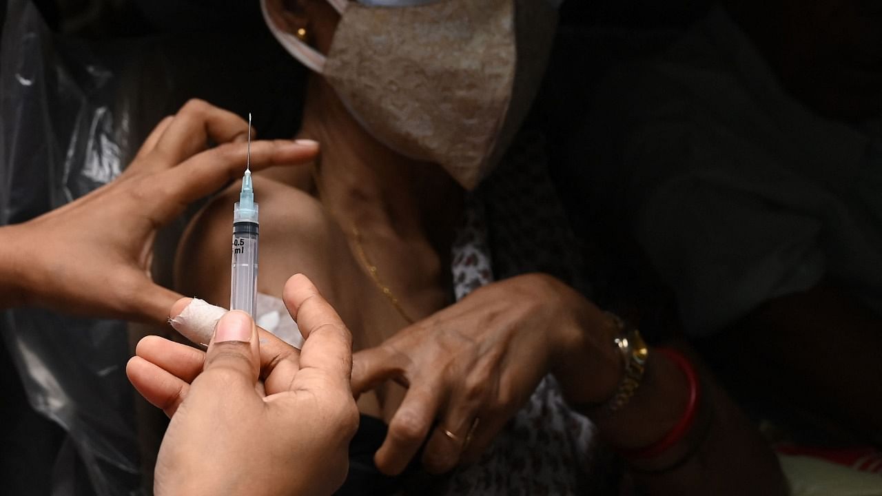 In the letter, the health ministry said it was overwhelming to see that all the states are using the system to update the stock and transactions of Covid vaccines on a daily basis. Credit: AFP Photo