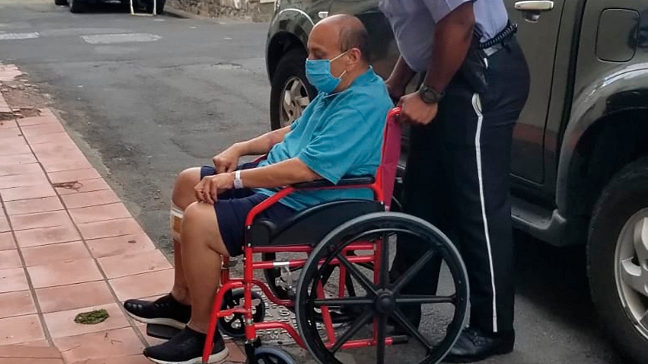 Indian citizen Mehul Choksi is taken in a wheelchair to the Magistrate's court by police after his arrest for illegal entry into the country. Credit: AP
