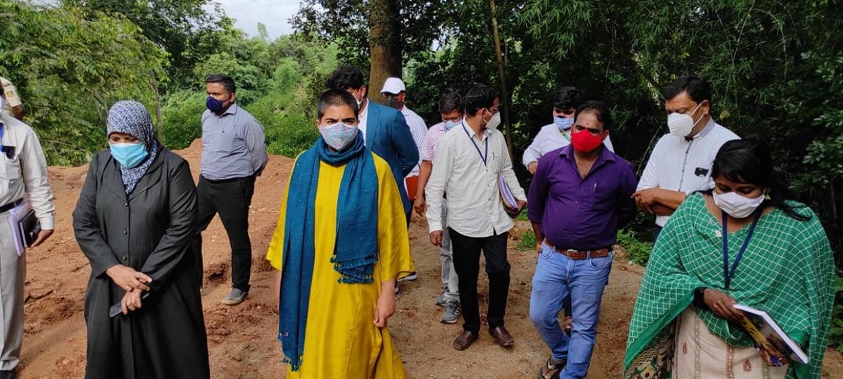 Deputy Commissioner Charulata Somal inspects a flood-prone area in Kushalnagar.