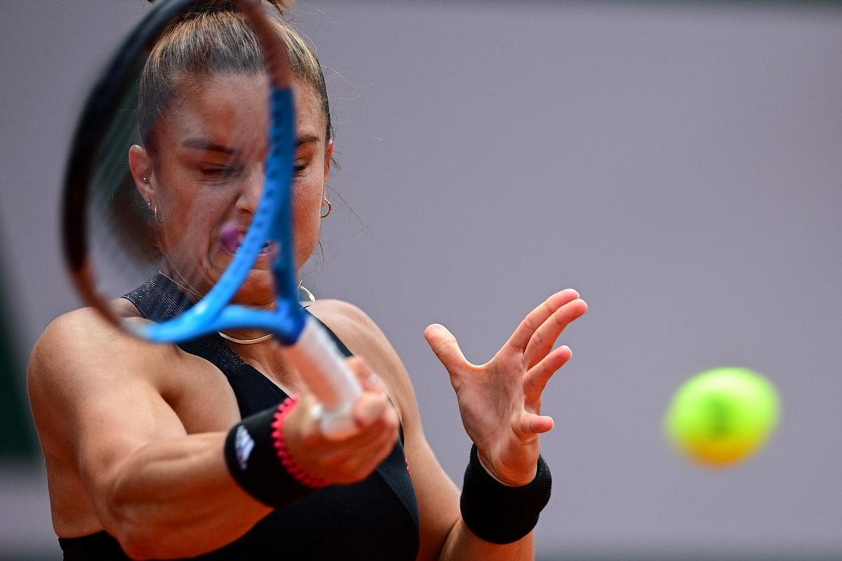 Greece's Maria Sakkari returns the ball to Poland's Iga Swiatek during their women's singles quarter-final tennis match. Credit: AFP Photo