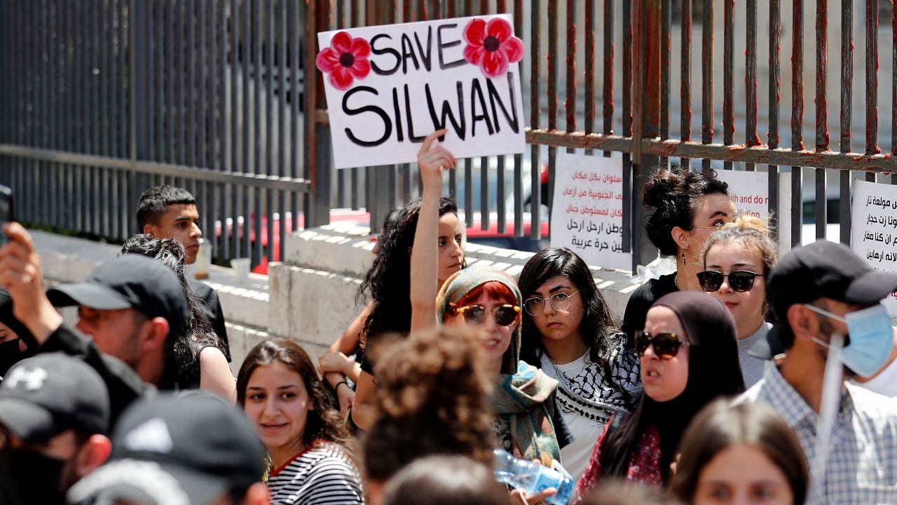 Palestinians shout slogans outside the court in Jerusalem during a protest over Israel's planned evictions of Palestinian families from homes in the eastern sector's Silwan district. Credit: AFP File Photo