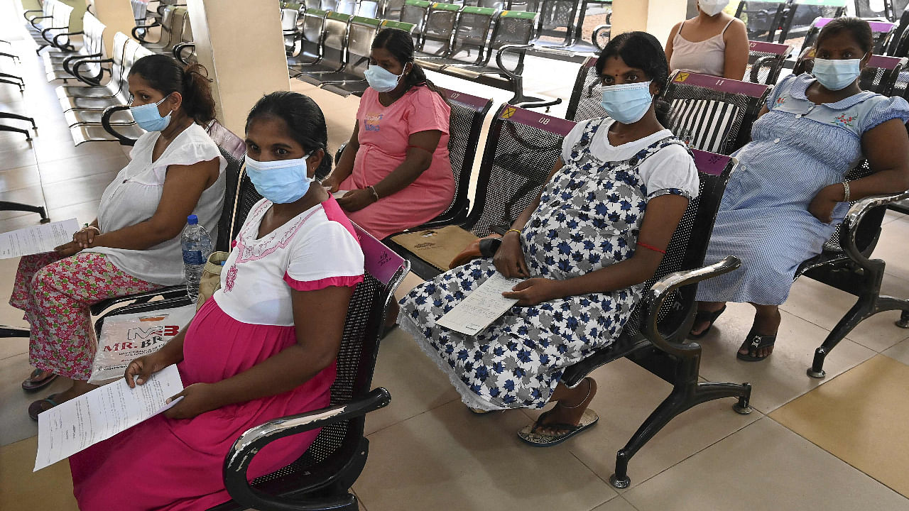 Pregnant women wait to get a dose of the Chinese-made Sinopharm Covid-19 vaccine in Sri Lanka. Credit: AFP Photo