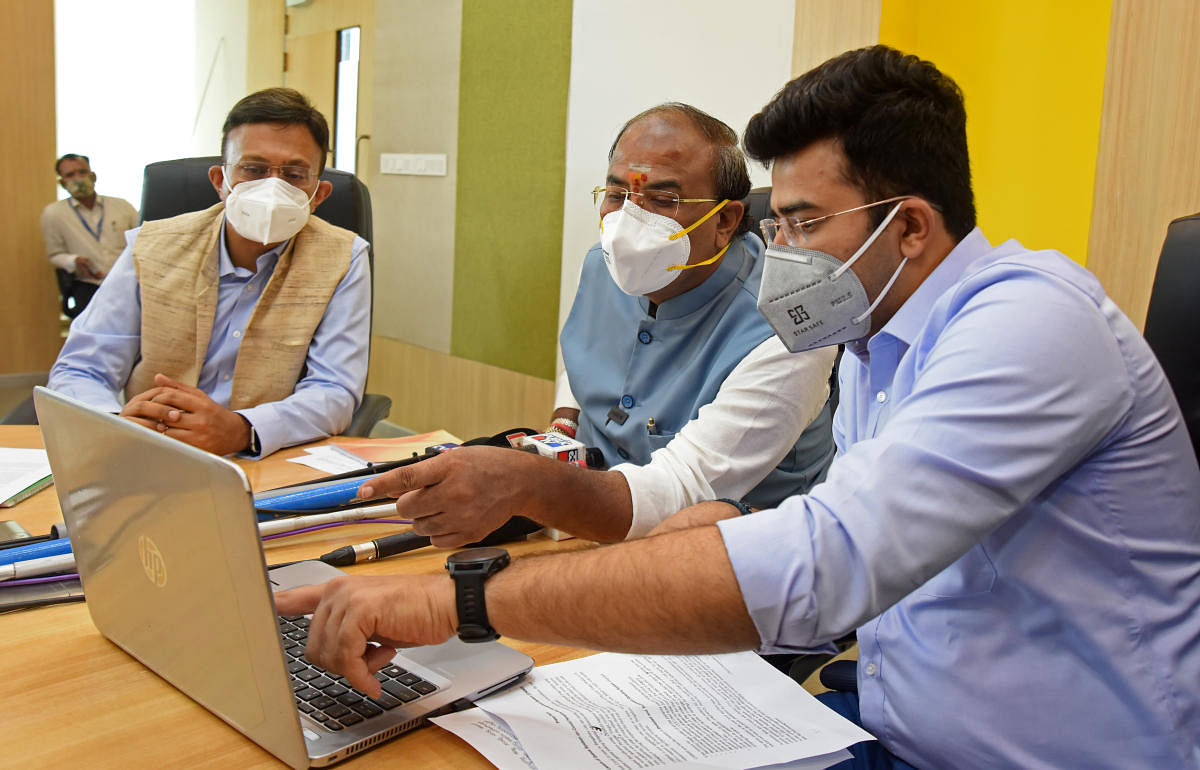 Minister Aravind Limbavali, MP L S Tejasvi Surya and BBMP chief commissioner Gaurav Gupta at the launch of the software for Covid hospital bed management in Bengaluru on Thursday. DH Photo/M S Manjunath