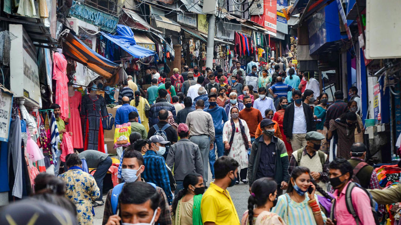 People crowd at Lower Bazar during relaxation hours of Covid-19 lockdown, in Shimla. Credit: PTI Photo