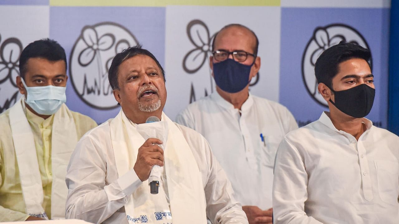 BJP leader Mukul Roy with TMC National General Secretary Abhisekh Banerjee during his re-joining of TMC party, at TMC Bhavan in Kolkata, Friday, June 11, 2021. Credit: PTI Photo