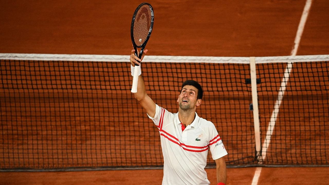 Novak Djokovic celebrates after winning against Rafael Nadal at the end of their French Open men's singles semi-final in Paris. Credit: AFP Photo