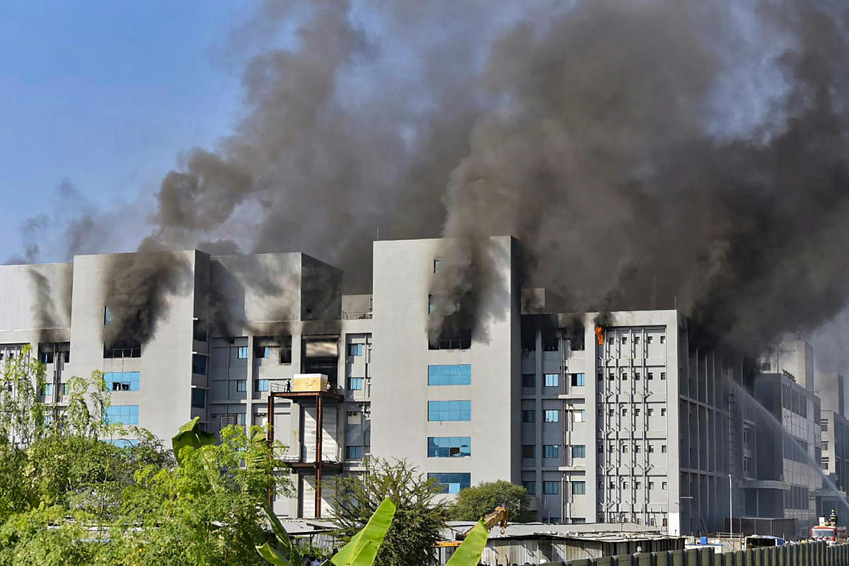 Smoke billows out after a massive fire broke out at the Serum Institute of India in Pune on January 21, 2021. Credit: PTI Photo