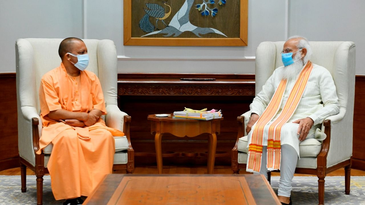 Prime Minister Narendra Modi with Uttar Pradesh CM Yogi Adityanath during a meeting, in New Delhi. Credit: PTI Photo