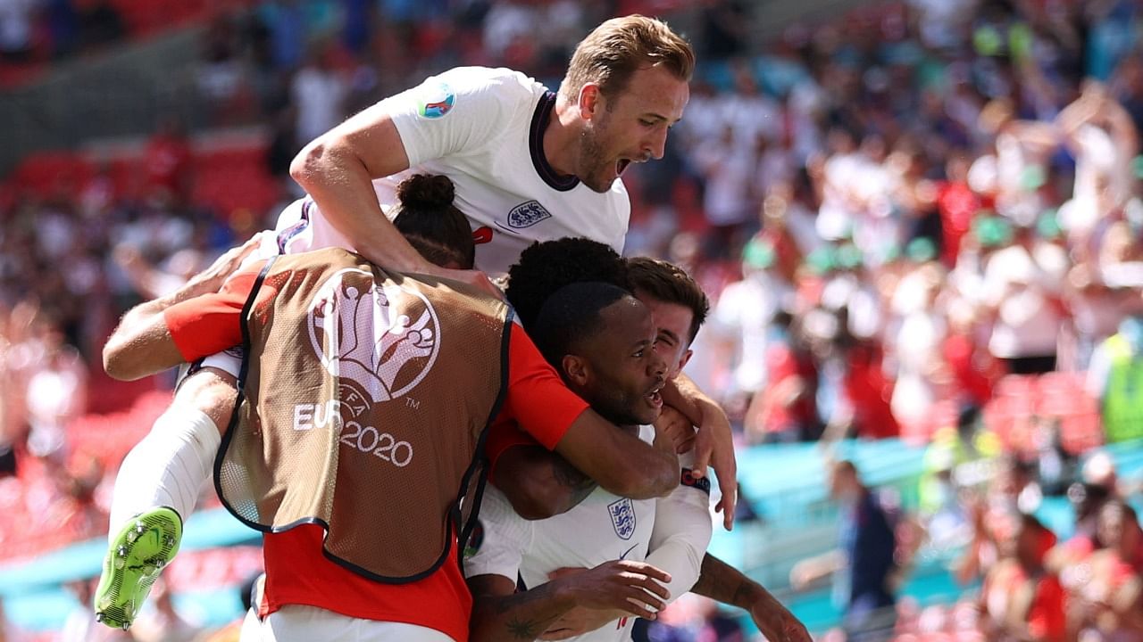 England's Raheem Sterling celebrates scoring their first goal with teammates. Credit: Reuters File