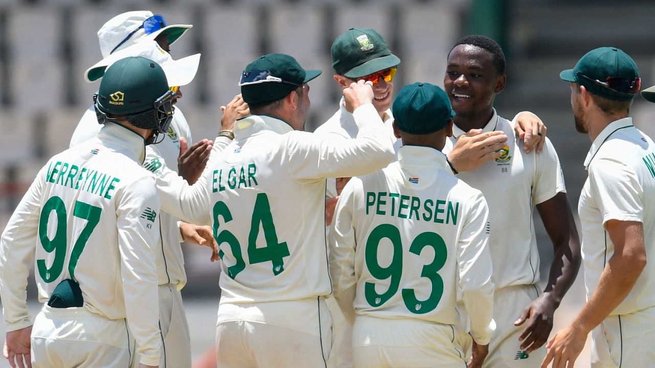 Kagiso Rabada (2R) of South Africa celebrates the dismissal of Joshua de Silva of West Indies during day 3 of the 1st Test against West Indies. Credit: AFP Photo