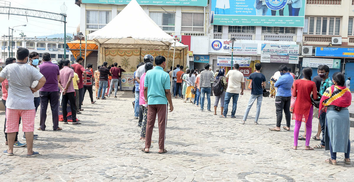 People line up for Covid-19 tests in Mysuru. Credit: DH File Photo