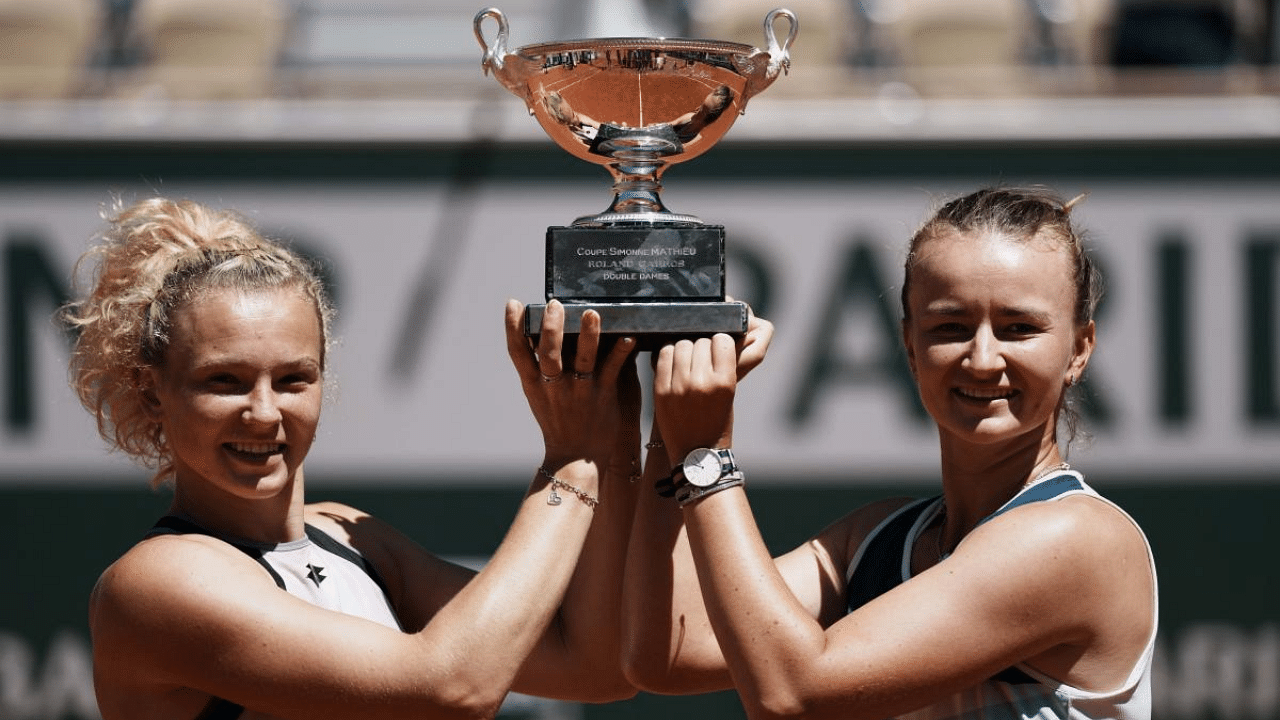 Czech Republic's Barbora Krejcikova, right, and compatriot Katerina Siniakova hold the cup. Credit: AP Photo