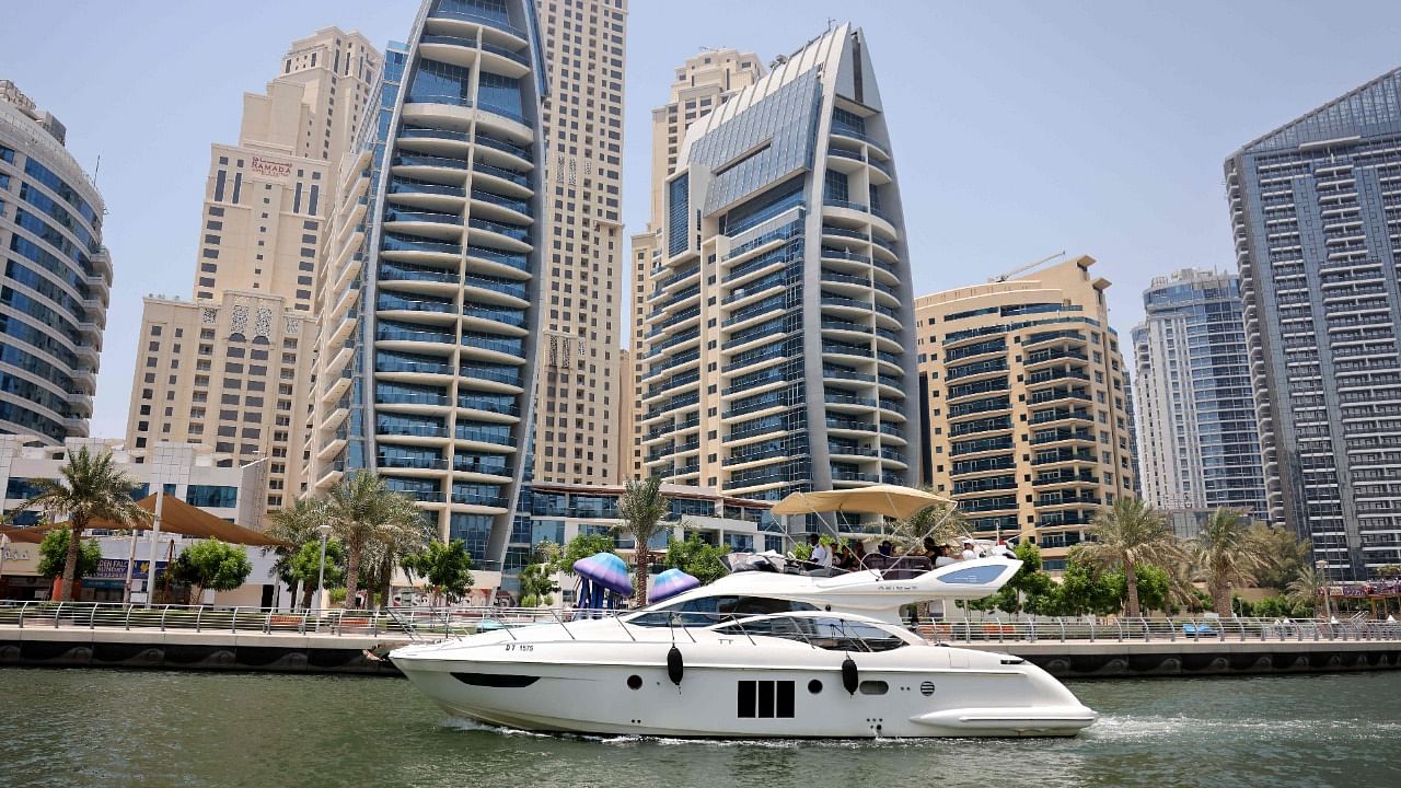 A luxury yacht is pictured off the Dubai Marina Beach in the Gulf emirate. Credit: AFP Photo