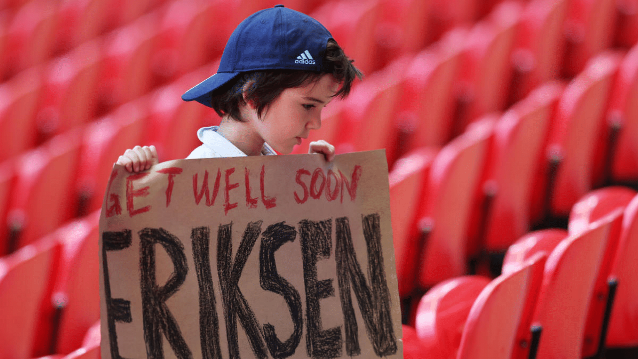 A fan holds a banner of support for Denmark's Christian Eriksen. Credit: Reuters Photo