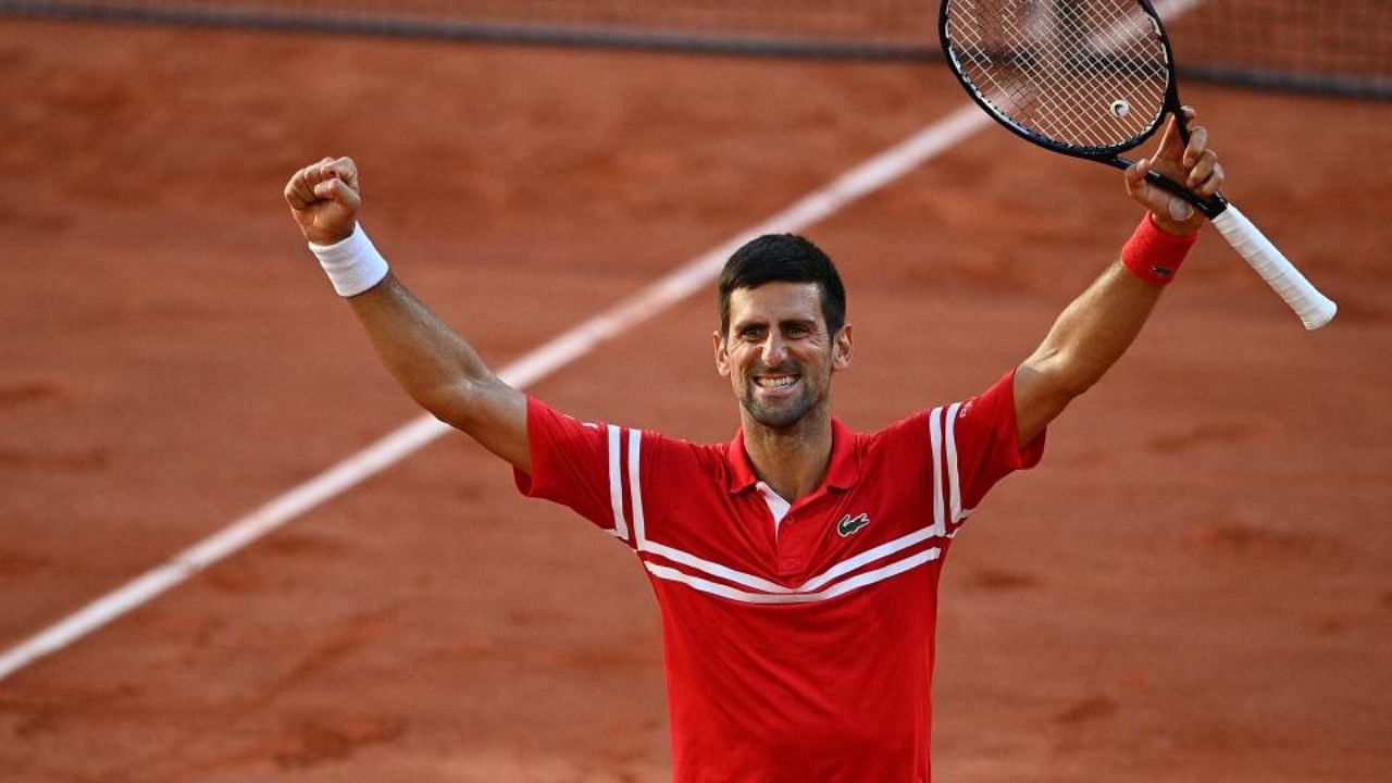 Serbia's Novak Djokovic celebrates after winning against Greece's Stefanos Tsitsipas at the end of their French Open men's final tennis match in Paris. Credit: AFP Photo