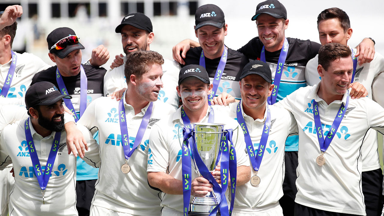 New Zealand's Tom Latham celebrates winning the series with the trophy and teammates. Credit: Reuters Photo