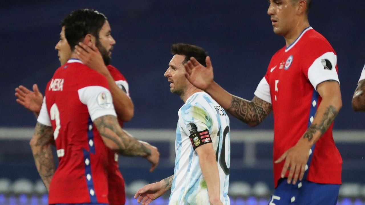 Lionel Messi looks dejected after Argentina are held to a draw by Chile. Credit: Reuters Photo