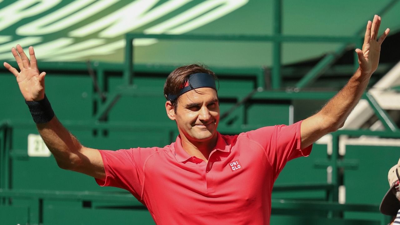 Roger Federer celebrates after winning his ATP Tour Singles, Men, 1st Round match against Ilya Ivashka from Belarus in Halle, Germany. Credit: AP/PTI Photo