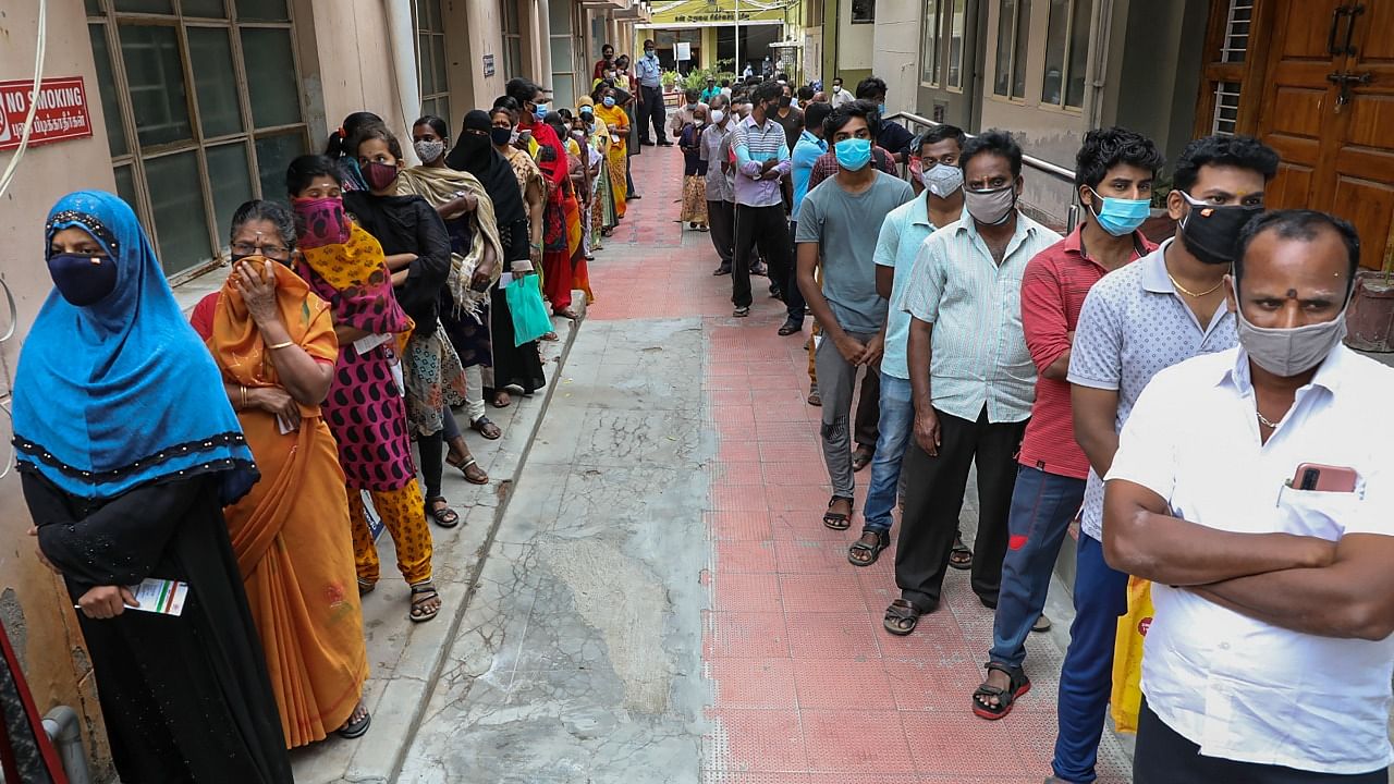 Beneficiaries wait to receive a dose of Covid-19 vaccine at a government hospital in Krishnagiri, Monday, June 14, 2021. Credit: PTI Photo
