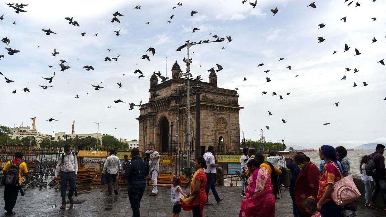 Tourists gather near the Gateway of India in Mumbai. Credit: AFP Photo